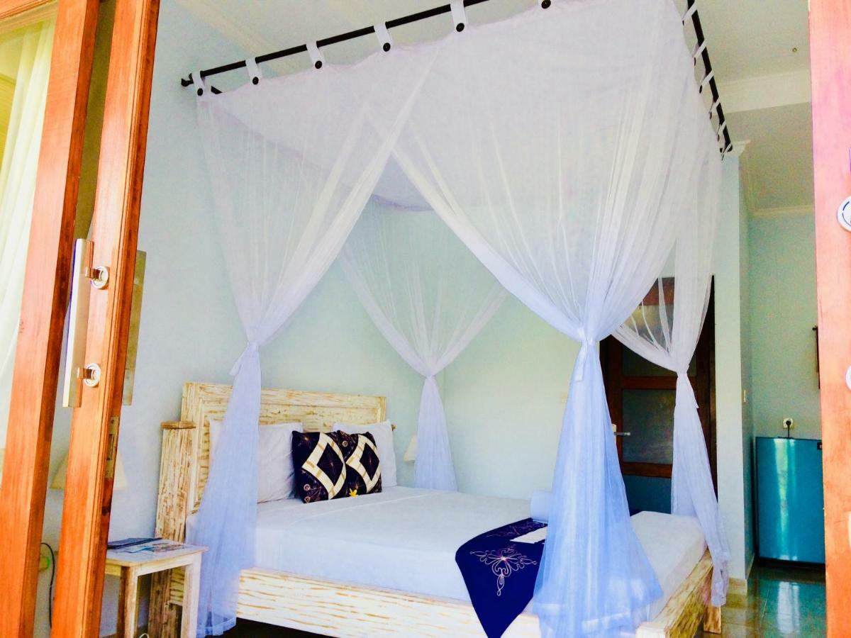 D'Uma Amed Homestay Buitenkant foto